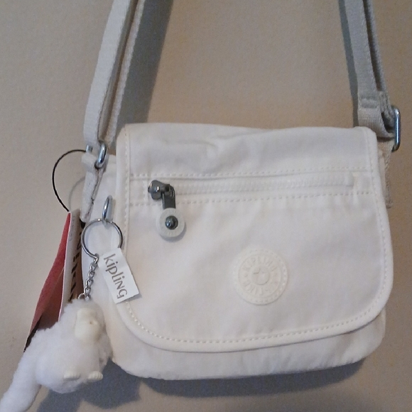 Kipling Handbags - Kipling White Crossbody with Plush Monkey Charm